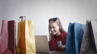 happy woman shopping online at home